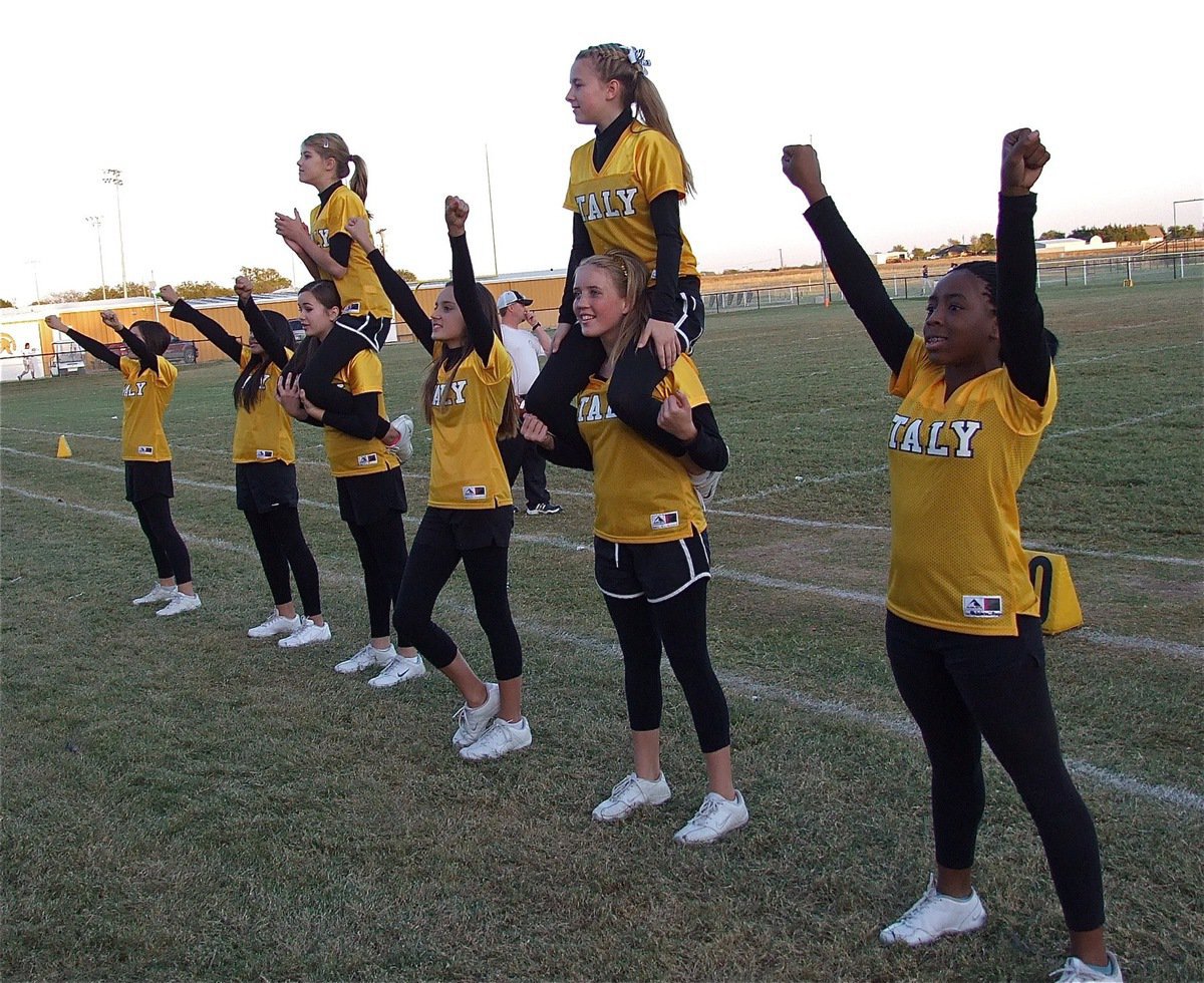 Image: Italy Jr High/JV cheerleaders Kaci Bales, Lizzie Garcia, Amber Hooker, Halee Turner, Jozie Perkins, Britney Chambers, Hannah Washington and Quintera Washington carry Italy on their shoulders.