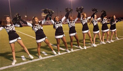 Image: The cheerleaders lineup for the school song during the pre-game.