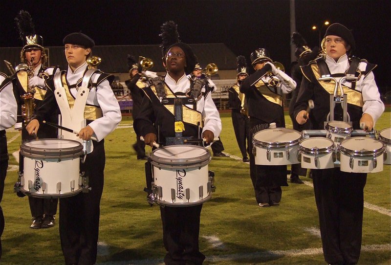 Image: Whitney Wolaver, Brenya WIlliams and Brett Kirton help deliver, “The Beat of Champions.”