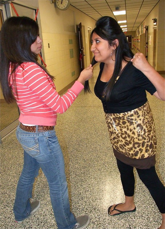 Image: Suzy “Snooky” Rodriguez goes crazy on unsuspecting IHS student, Alma Suaste.