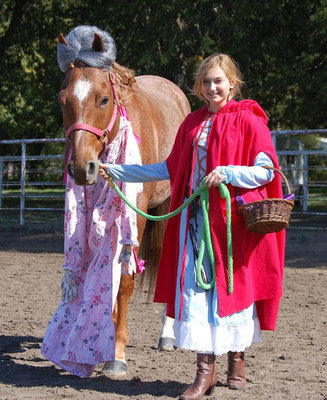 Image: Kyla Chandler of Maypearl won Best Overall costume as she and her horse depicted Little Red Riding Hood and her horse was the wolf dressed up as grandma.