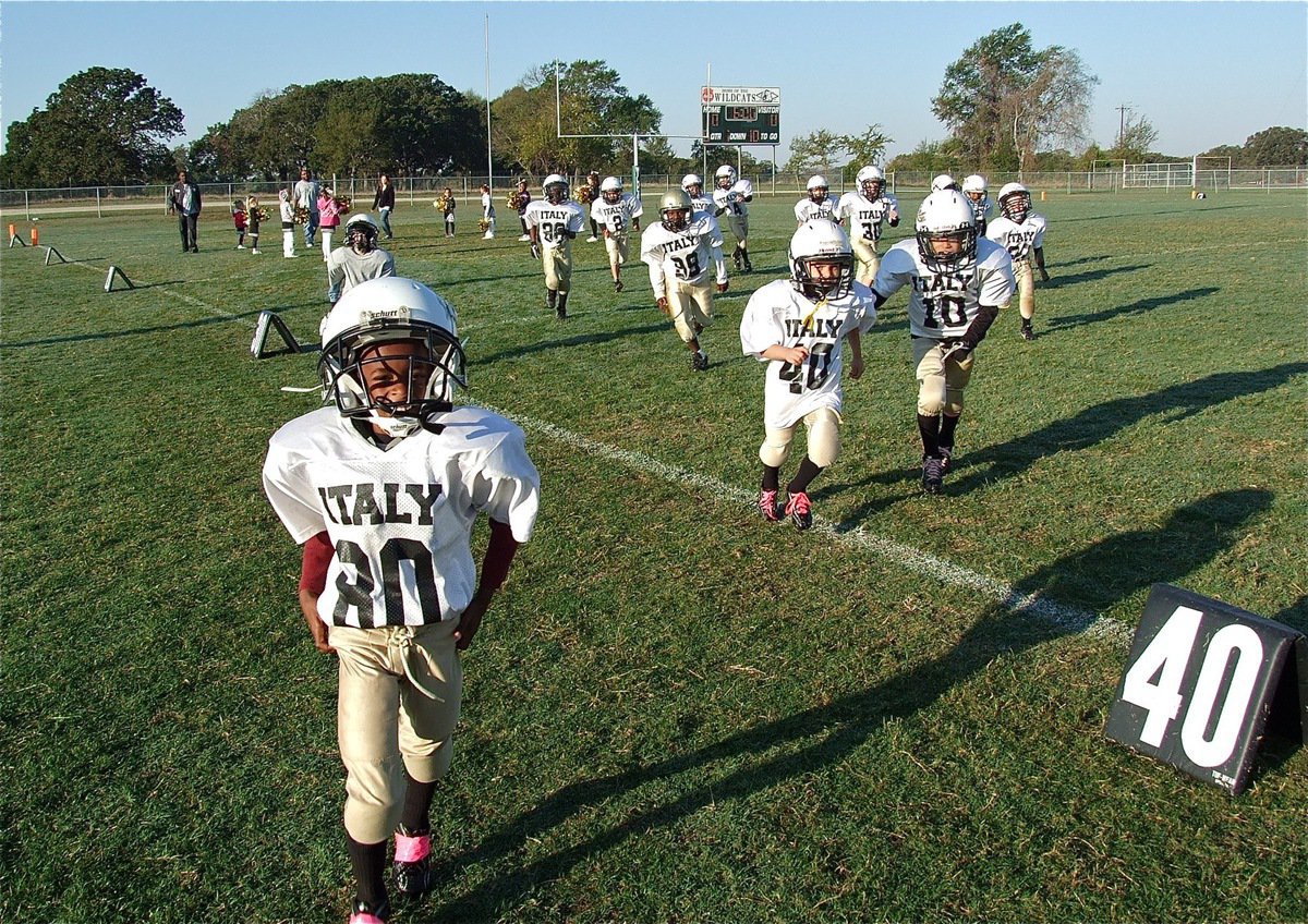 Image: The IYAA C-Team Gladiators charge onto the Scurry field to take on the Wildcats Saturday.