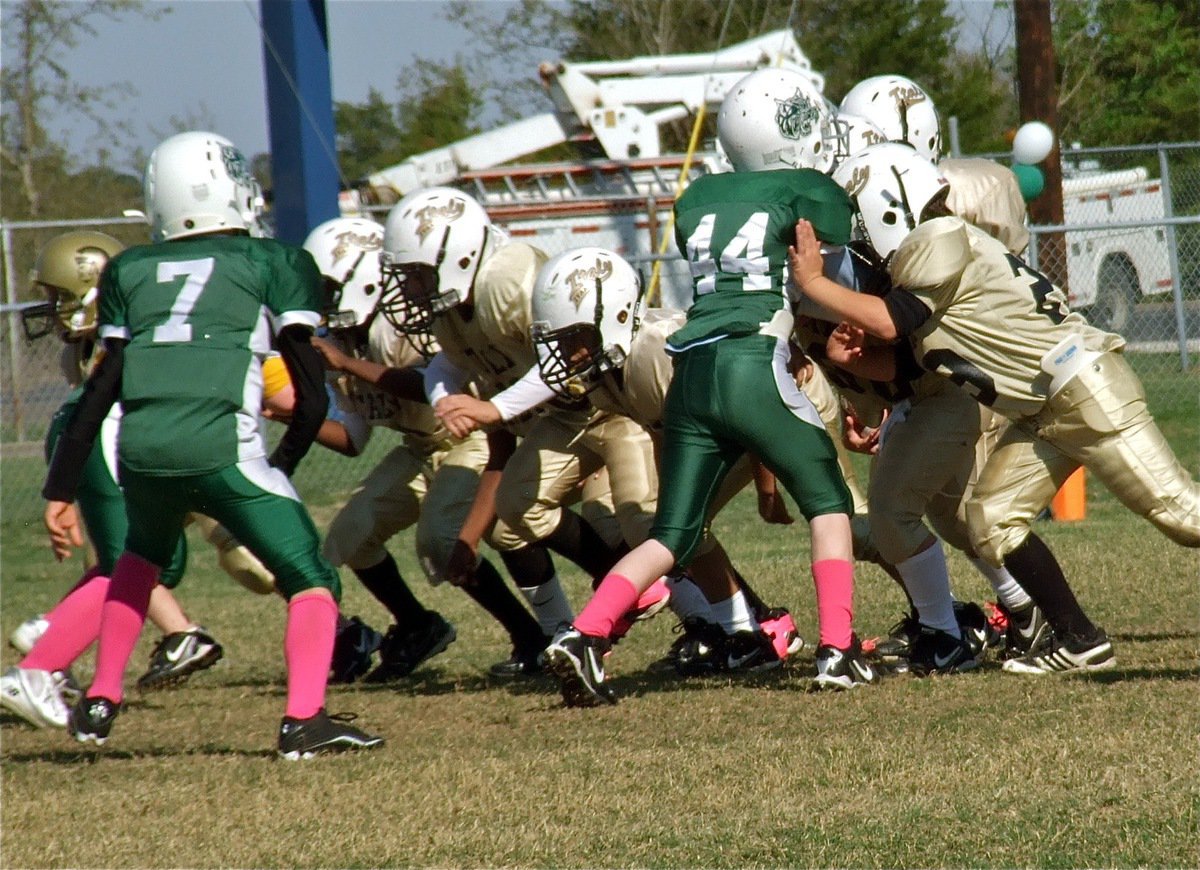 Image: Gage Wafer(29) takes aim at a Wildcat defender as he and IYAA B-Team teammates fire off the ball low and hard.