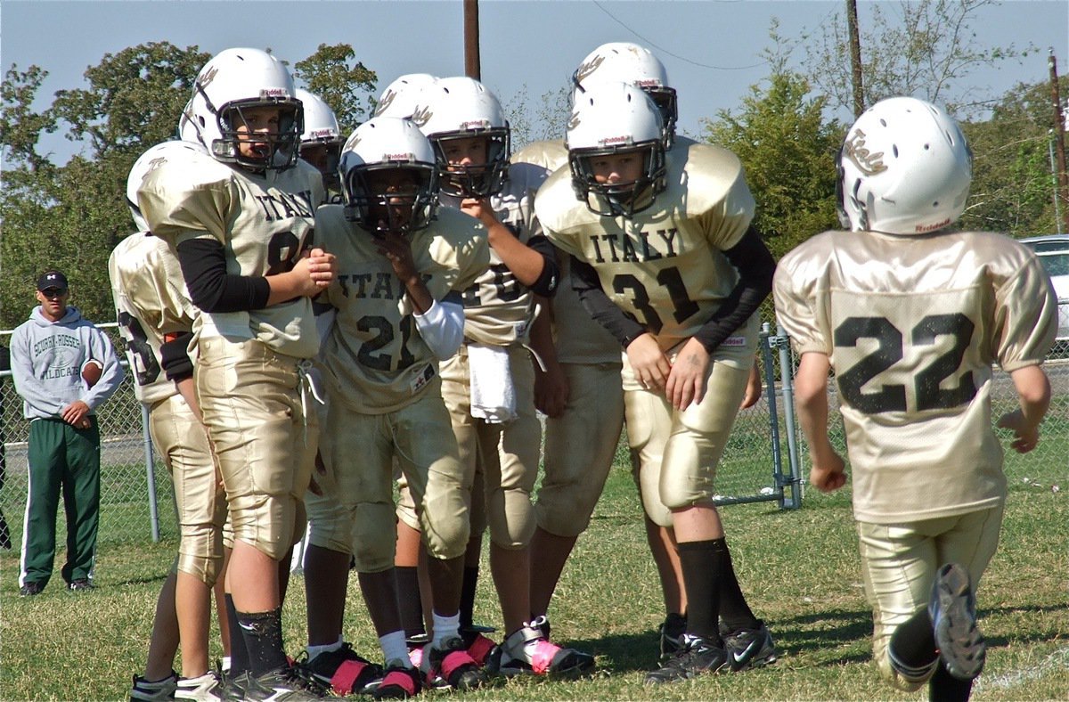 Image: The A-Team huddle can hardly wait for the incoming play from Miguel Martinez.