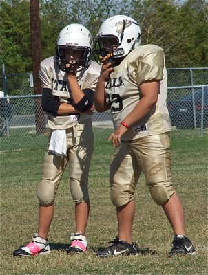 Image: IYAA A-Team Gladiators Gary Escamilla(40) and Austin Lowe(93) try to decipher Scurry’s offensive formation.