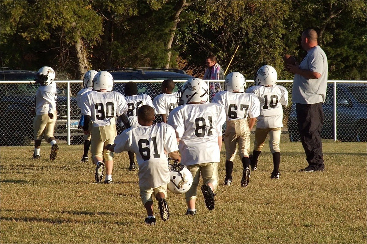 Image: C-Team head coach, Aaron Itson, gets his team ready to warmup.