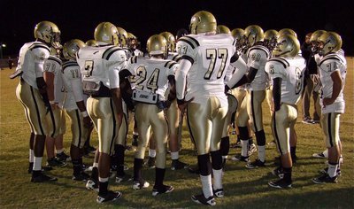 Image: Gladiators huddle together as a team before the game against Centerville.
