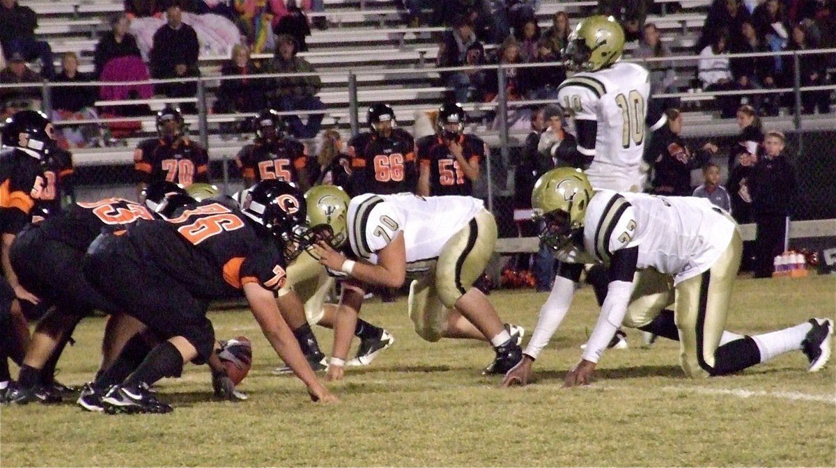 Image: Defensive linemen Isaac Medrano(70) and Larry Mayberry, Jr.(77) get set to attack the Tigers with linebacker Ryheem Walker(10) stalking the Centerville backfield.