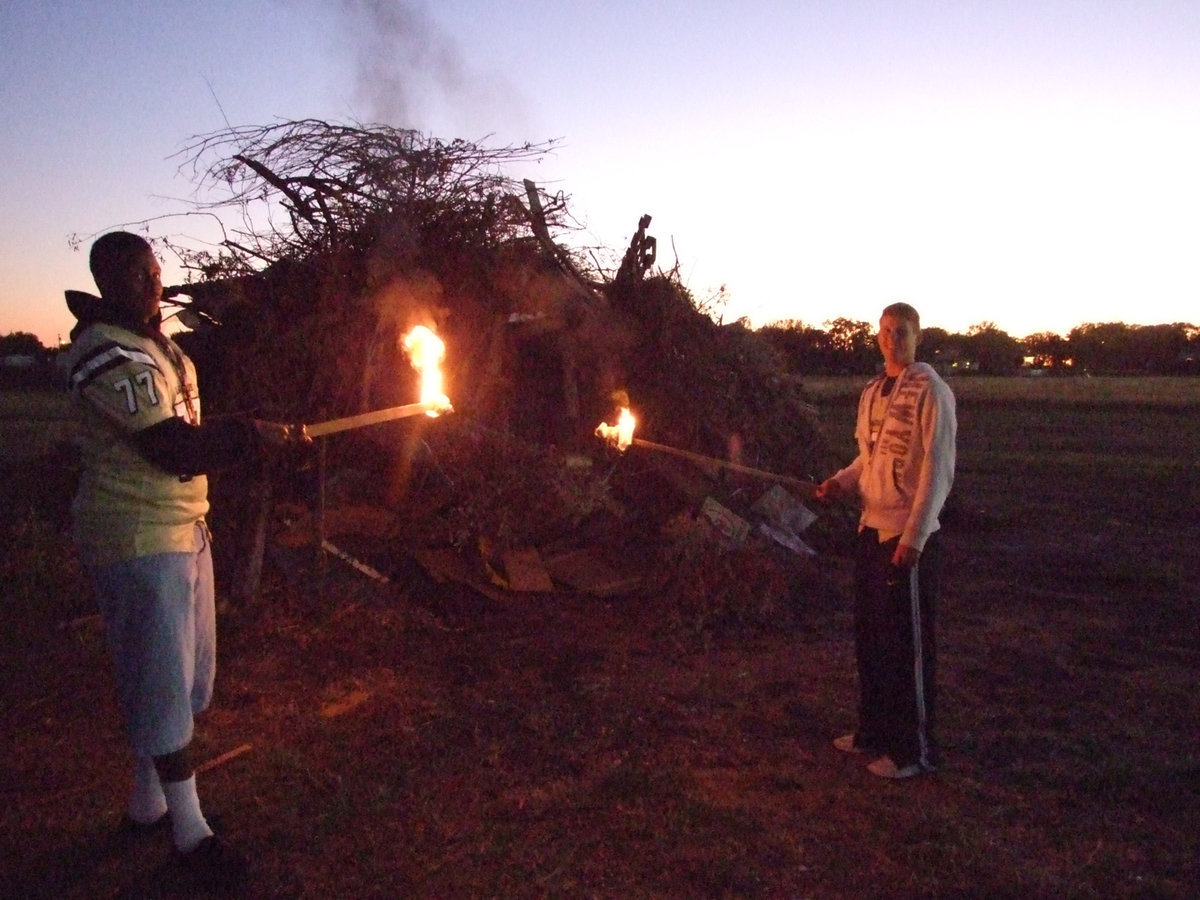 Image: Team Captains Larry Mayberry and Jase Holden torch the Lions.