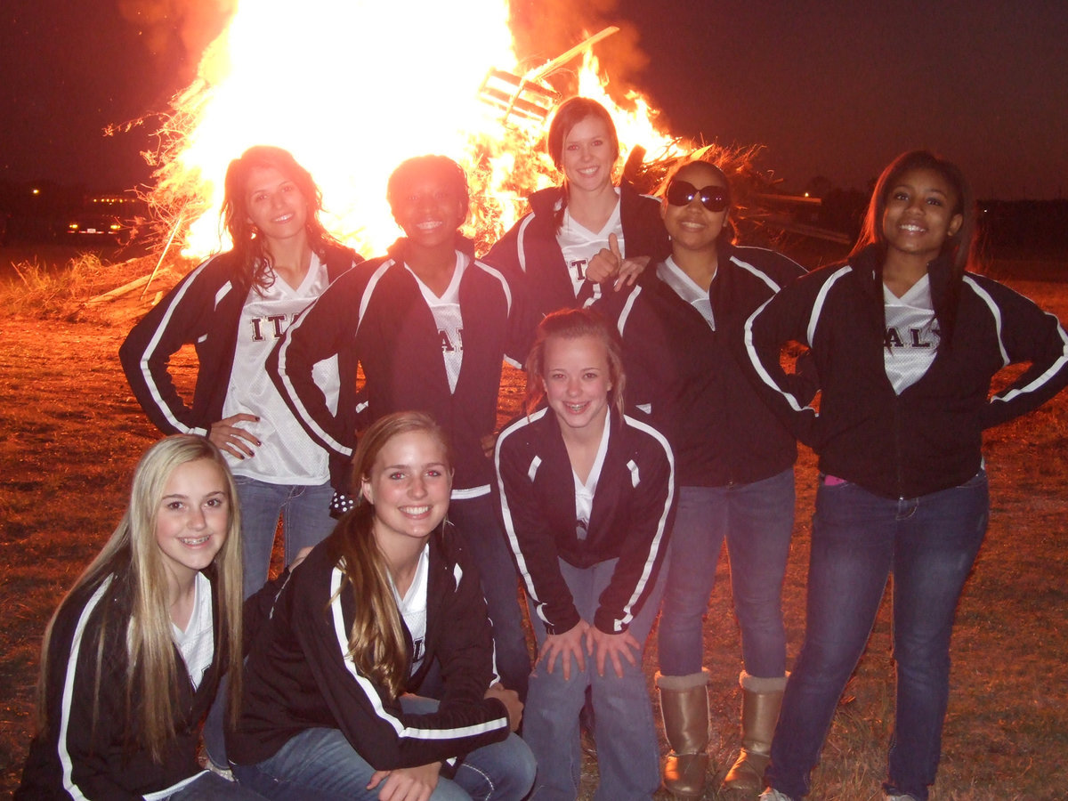 Image: The Lady Gladiator Cheerleaders cheer on the varsity team before the playoff game.