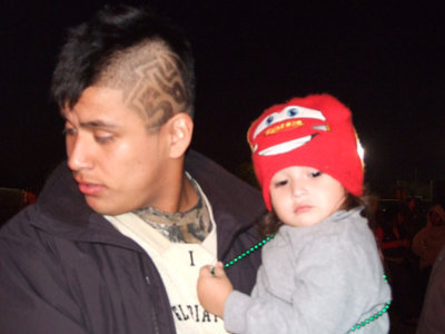 Image: Gladiator uncle Omar Estrada shows off his nephew, Jaden, and his new hair cut.  Can you see #56?