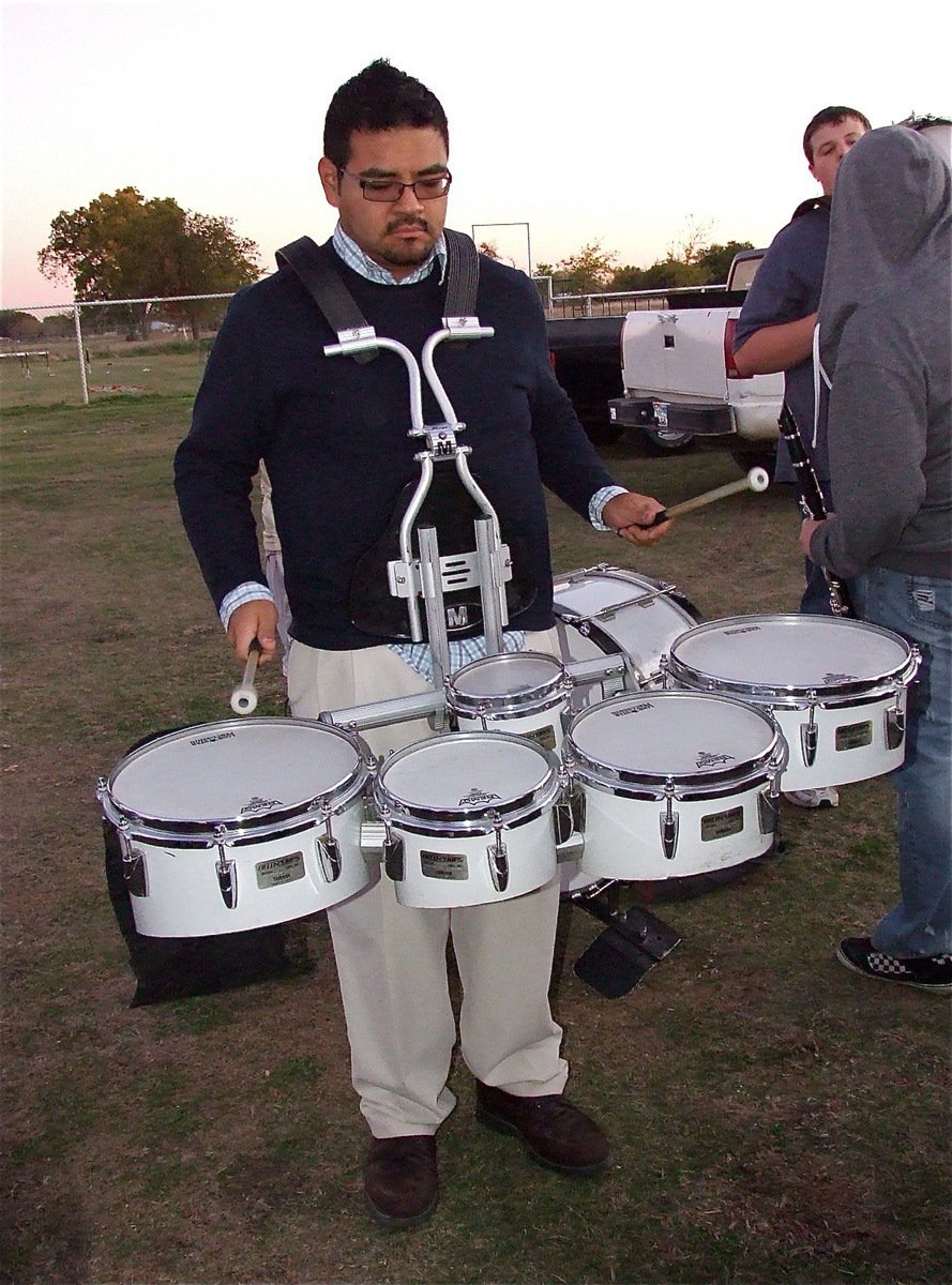 Image: Mr. Perez is on fire while playing the drums during the pep rally.