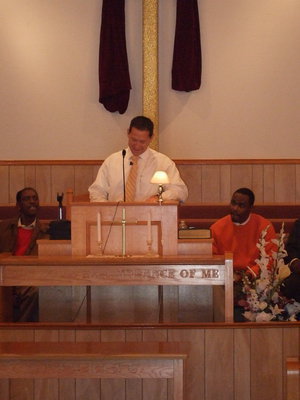 Image: Pastor Todd Gray reads the message.