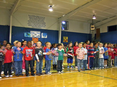 Image: Kindergarten and first grade singing When the Flag Goes By.