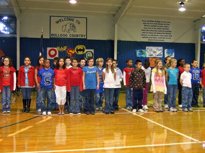 Image: Second and third graders singing America My Homeland.