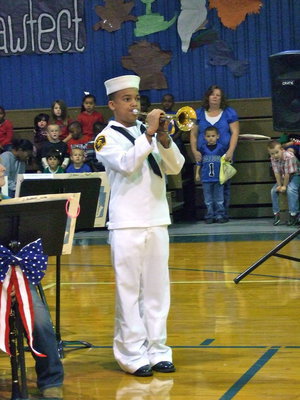 Image: Jaquay Brown (Navy Sea Cadet) playing Taps.