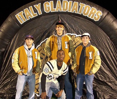 Image: Caden Jacinto, Cole Hopkins, Brandon Jacinto and Marvin Cox strike a pose before the playoff game against Franklin.