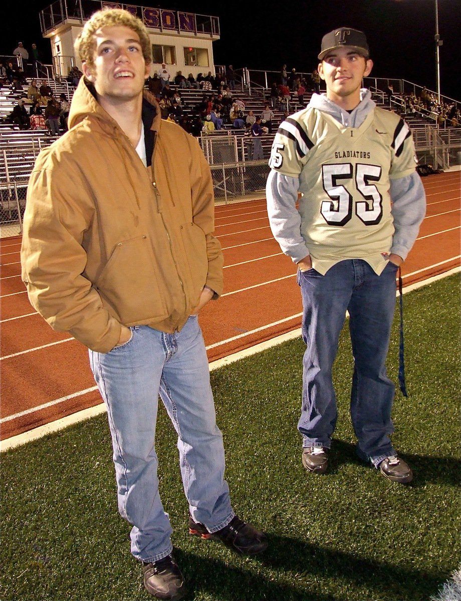 Image: Gladiators Brandon Souder(63) and Zackery Boykin(55) talk football before the kickoff.