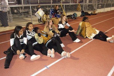 Image: The cheerleaders take a break.