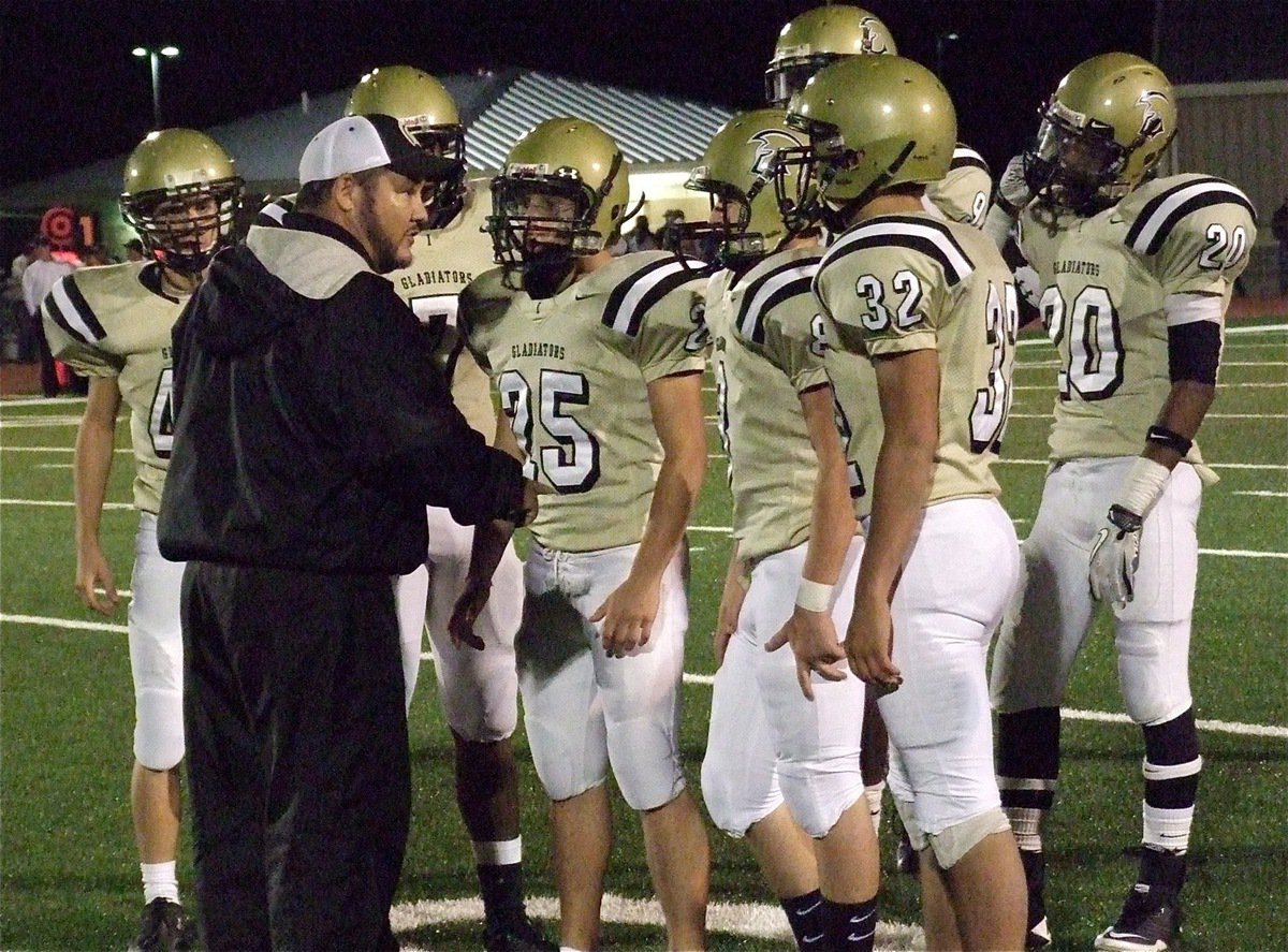 Image: Coach Bales talks with his kick return unit. Pictured are: Justin Wood(48), Paul Harris(7), Shad Newman(25), Hayden Wood(8), Cody Medrano(32), Devonta Simmons(9) and Trevon Robertson(20).