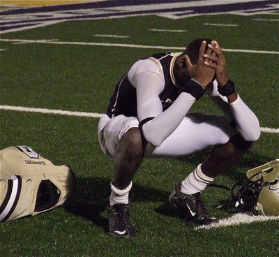 Image: Senior Gladiator receiver/safety Devonta Simmons(9) takes a moment as the finality of it all sinks in.