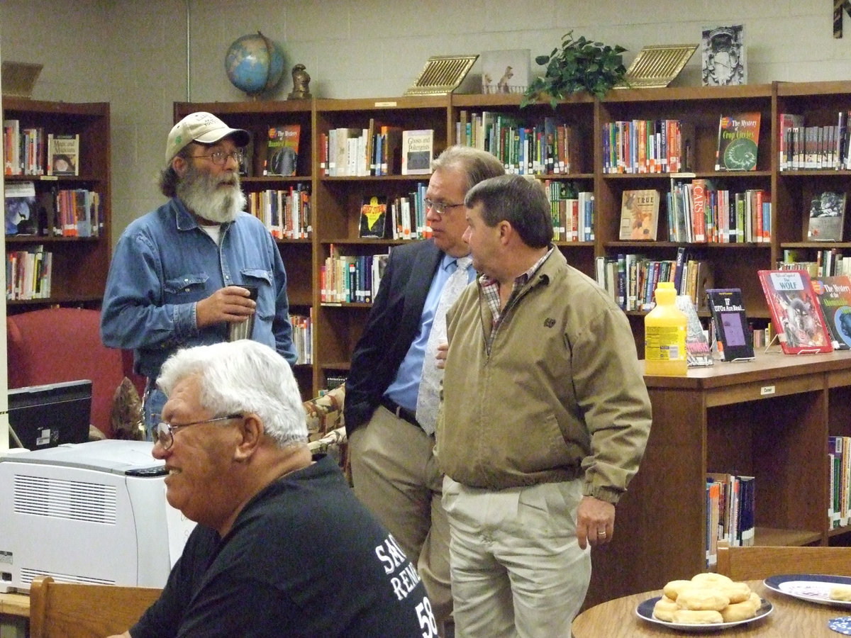 Image: Mark Souder, Barry Bassett and Larry Eubank take a minute and catch up on Veteran’s Day.