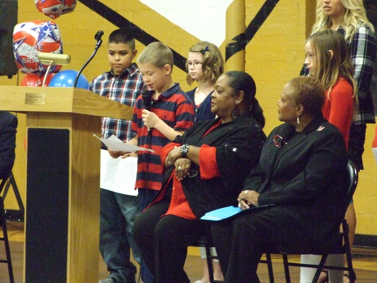 Image: Tanner Chambers explains what he is proud of to the veterans.