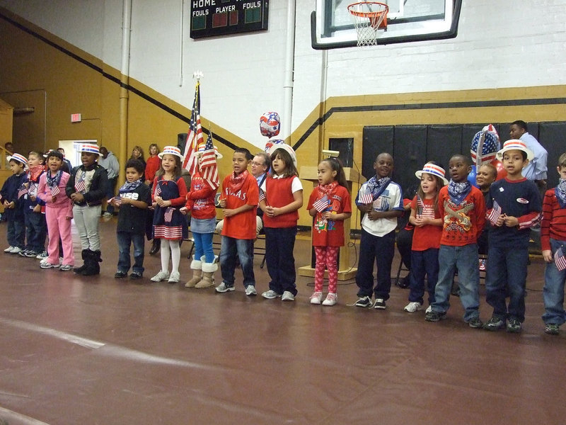 Image: Stafford Elementary presents the first grade singing, “Grand Ol’ Flag”.