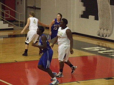 Image: Jaclynn Lewis(4) and Jimesha Reed(40) stay tight defensively.
