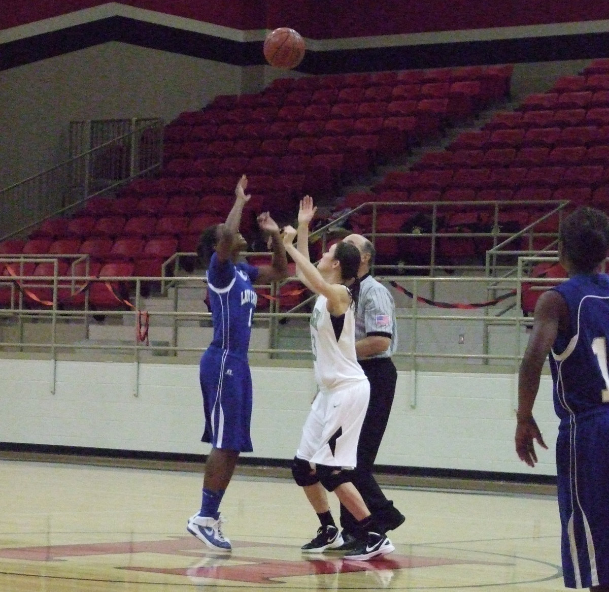 Image: Kaitlyn Rossa (senior) handles the tip off.