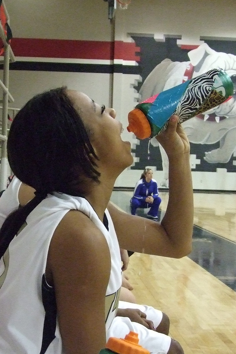 Image: Ryisha Copeland (sophomore) needs refreshment during the tough battle with Connally.