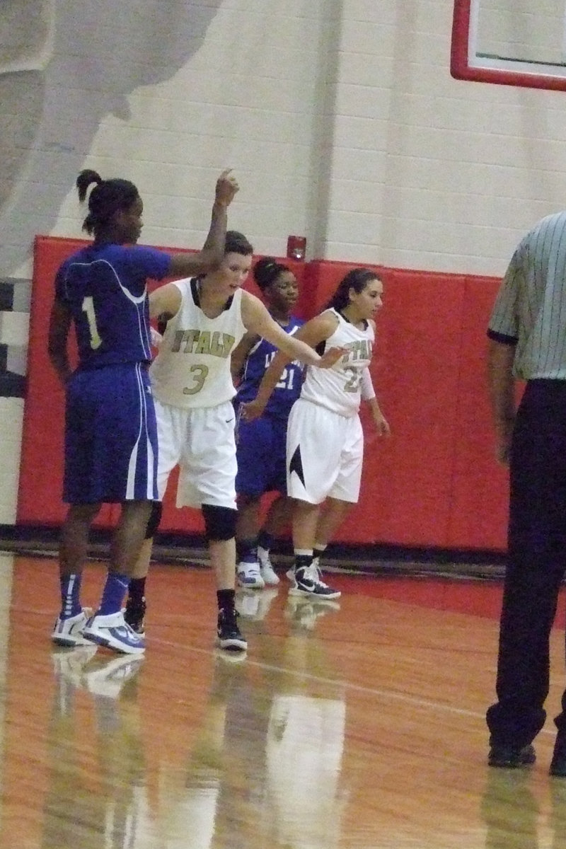 Image: Alyssa Richards (junior) and Rossa stay intense on defense.