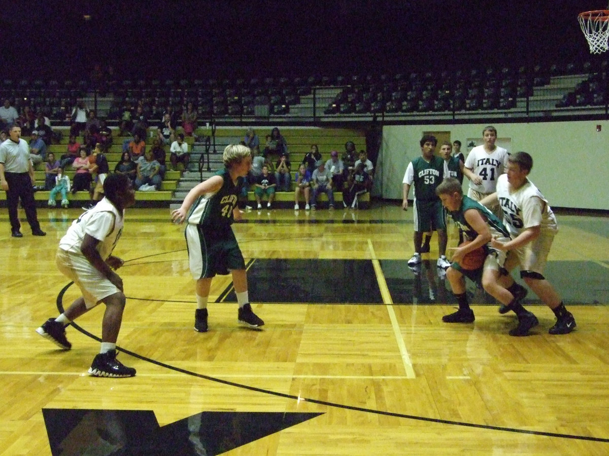 Image: 
    	Aaron Pittmon works around to steal the ball.
    