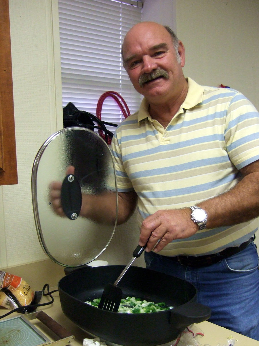 Image: Darrell Rosemond cooking up the ingredients for some wonderful breakfast burritos.