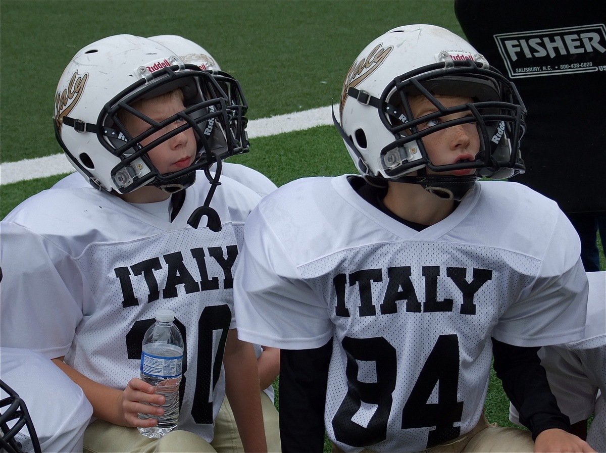 Image: Isaac Gray(30) and Taylor Sparks(84) intently listen to Coach Itson’s pre-Superbowl game speech.