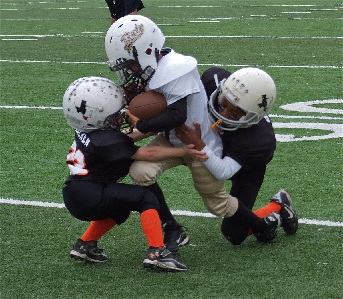 Image: Italy quarterback Laveranues Green(10) fights for extra yards against Ferris, in a game when every yard counts.