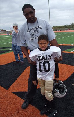 Image: Assistant C-Team coach Micahel Davis is proud of his grandson Laveranues Green(10) who has helped lead Italy to back-to-back Superbowl appearances, scoring a touchdown in both games.