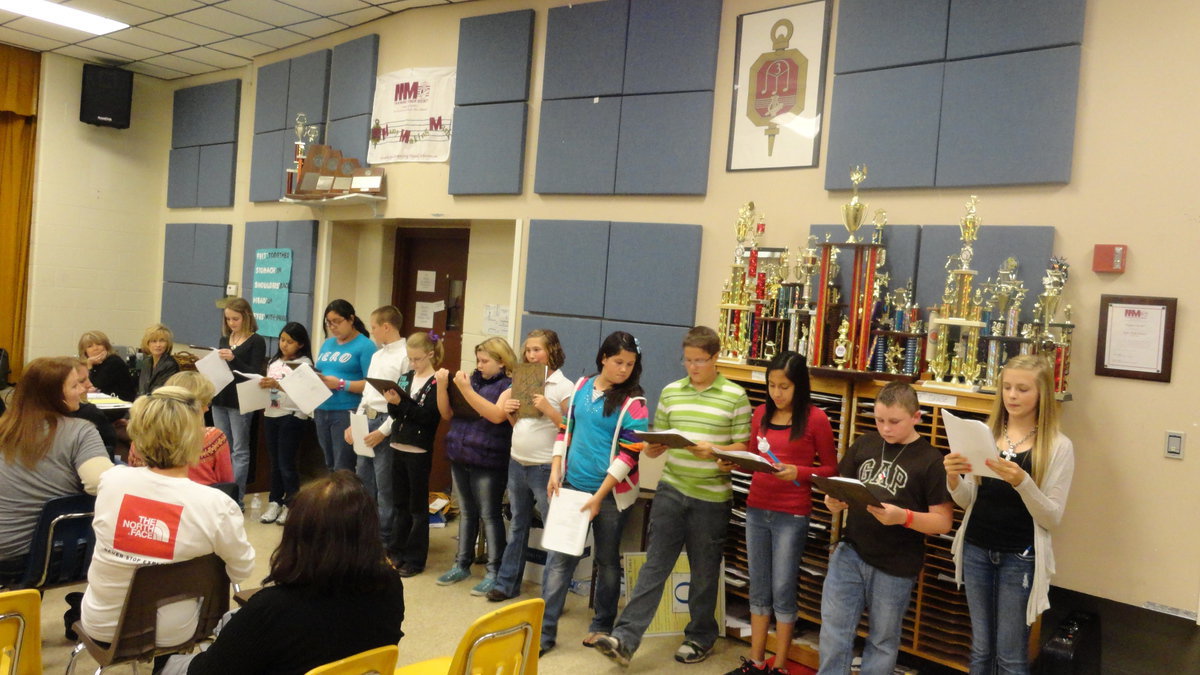 Image: Six graders present program about what they area learning in reading, math, science and social studies at school board meeting.