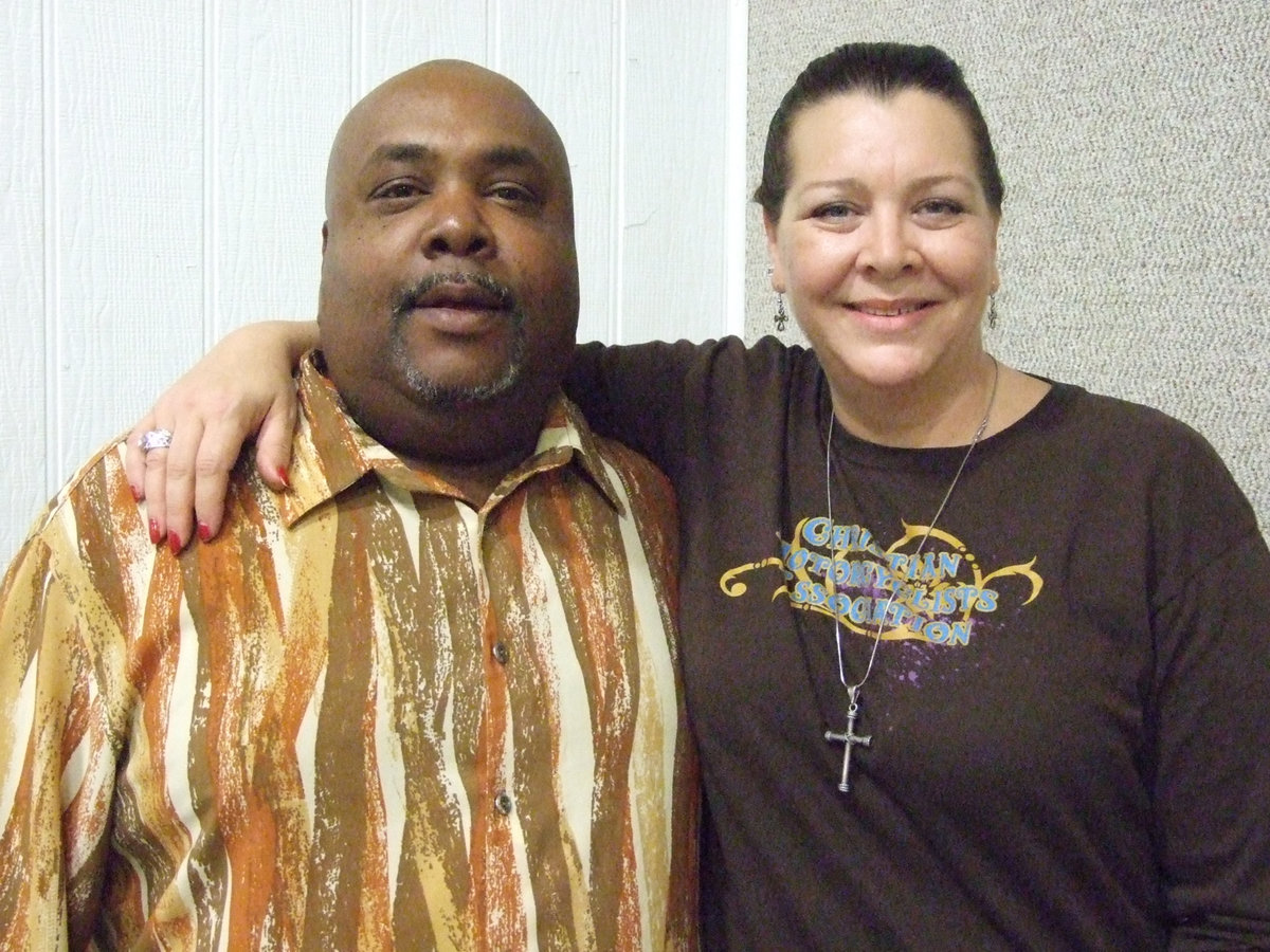 Image: Eric Madra, Mt. Gilead Baptist Church, and Chee Claus, CMA (Christian Motorcyclists Association) join together serving food during the Community Thanksgiving Feast on Sunday.