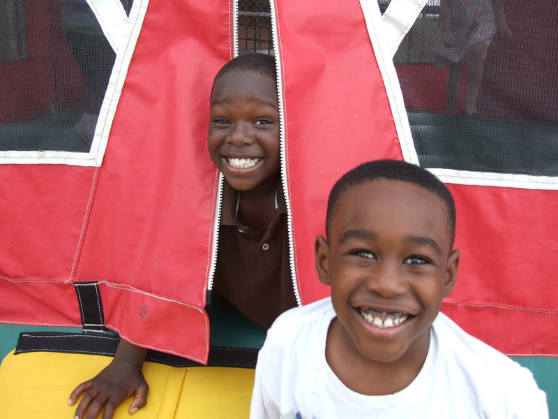 Image: Byron Davis, Jr. and Xavier Green are having a lot of fun at the community Thanksgiving feast.