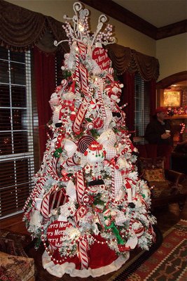 Image: Several Christmas trees, custom decorated by Mary Teat, were on display throughout the Haight home to welcome guests.