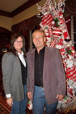 Image: Italy City Administrator Teri Murdock and her husband Luke pose in front of the Christmas tree.