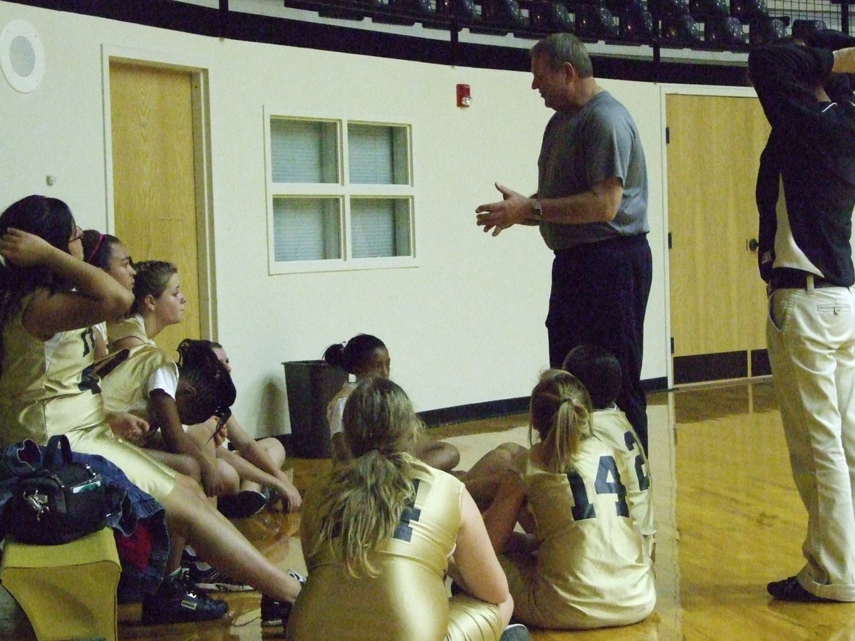 Image: Coach Parks and Coach Jennifer Reeves give instruction during the game.