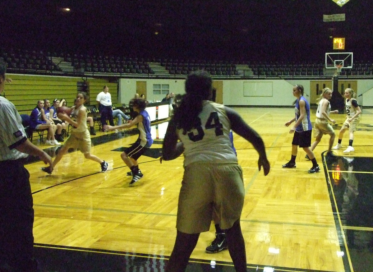 Image: Cassidy Childers(2) gets the ball from #34 Taleyia Wilson.