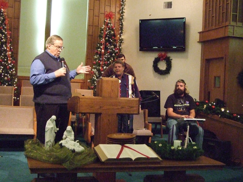 Image: Pastor Bill Morgan sang “Worthy is the Lamb” at the Sunday night service.