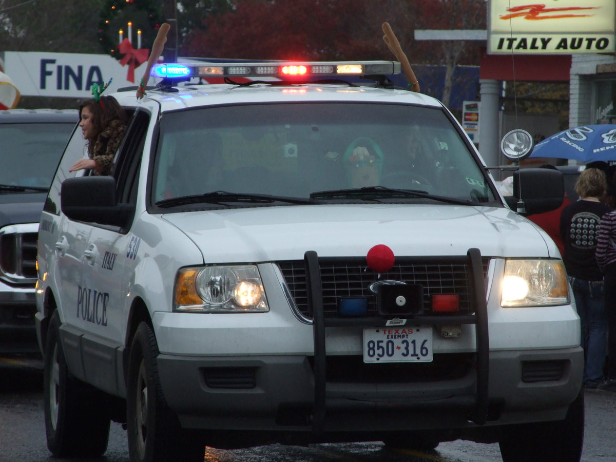 Image: Police Chief Diron Hill and his family lead the way and Grand Marshall the parade.