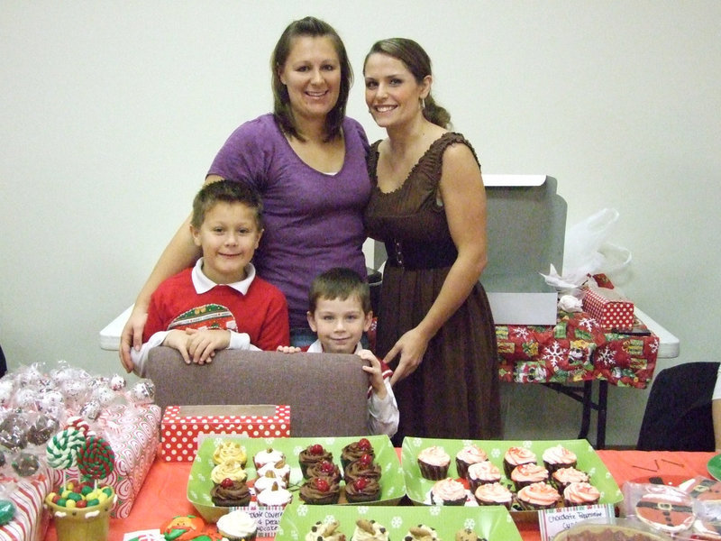 Image: Bridget Coers, owner of “Baking 4 Your Babies,” and April Gage work their booth and advertise for their new business.  They sell custom cakes and cupcakes for all occasions. Baking4yourbabies@weebly.com is their email address.