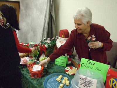 Image: Passing out free samples ensures orders for Christmas.
