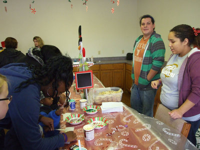 Image: Joey Tovar made sure there were enough cookies to decorate at the community center.
