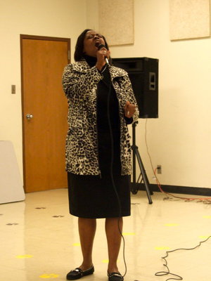 Image: Teresa Brown praising God for the good he is doing in Camisha’s life.